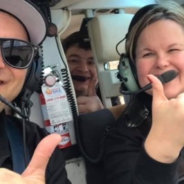 a person wearing sunglasses talking on a cell phone